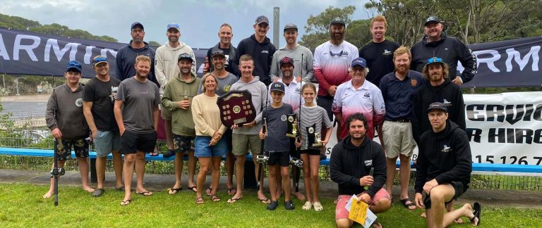 A group of anglers proudly holding their trophies at the Tathra Game Fishing Classic.