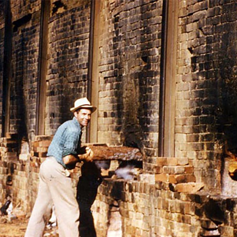 Rob Stafford firing the original Stafford’s kiln, carefully tending to the flames that powered the early days of the business.